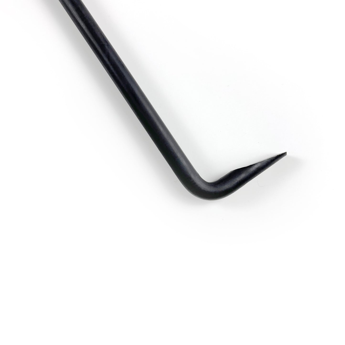 Close up of the hook at the end of a rounded steel poker that allows you to move logs effortlessly in a fire pit.