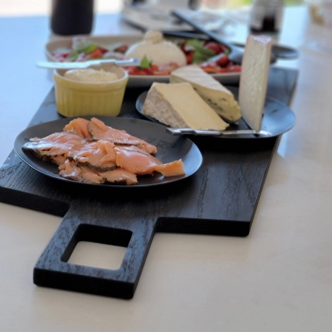 Oversized, blackened oak, food grade charcuterie boards. Ideal for serving many people at once. Uniquely designed by Big Wide Outside.