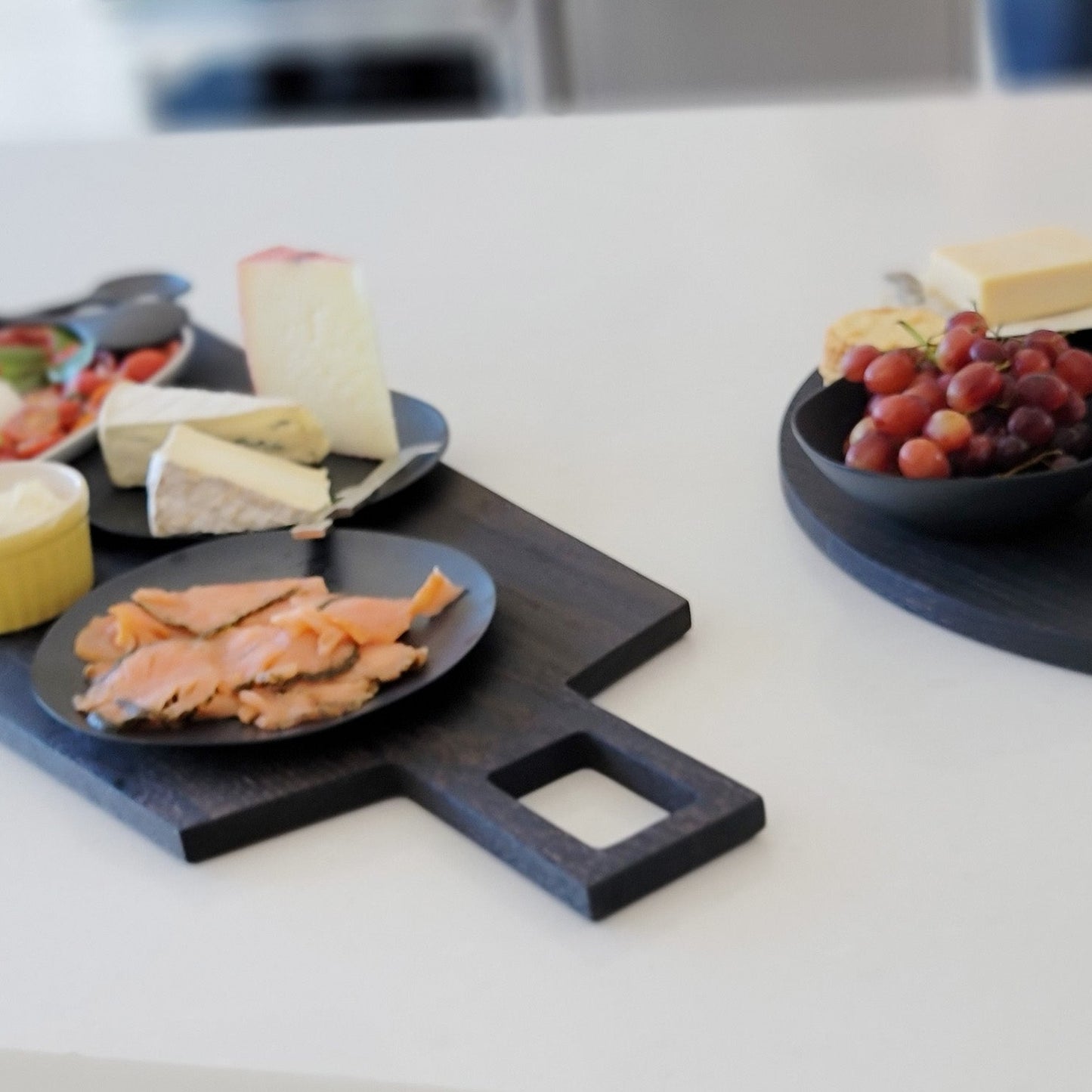 Oversized, blackened oak, food grade charcuterie boards. Ideal for serving many people at once. Uniquely designed by Big Wide Outside.