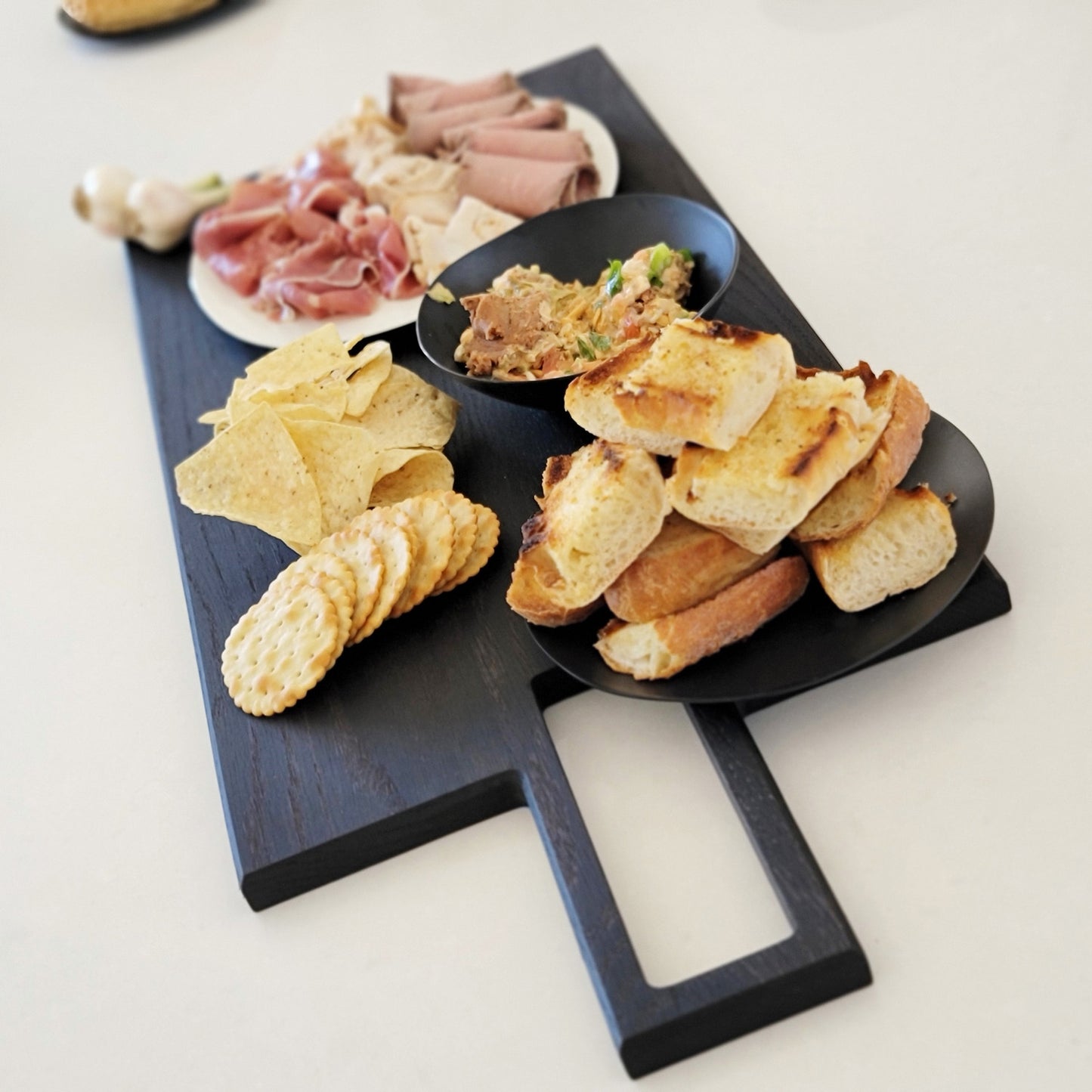 
                  
                    Oversized, blackened oak, food grade charcuterie boards. Ideal for serving many people at once. Uniquely designed by Big Wide Outside. 
                  
                