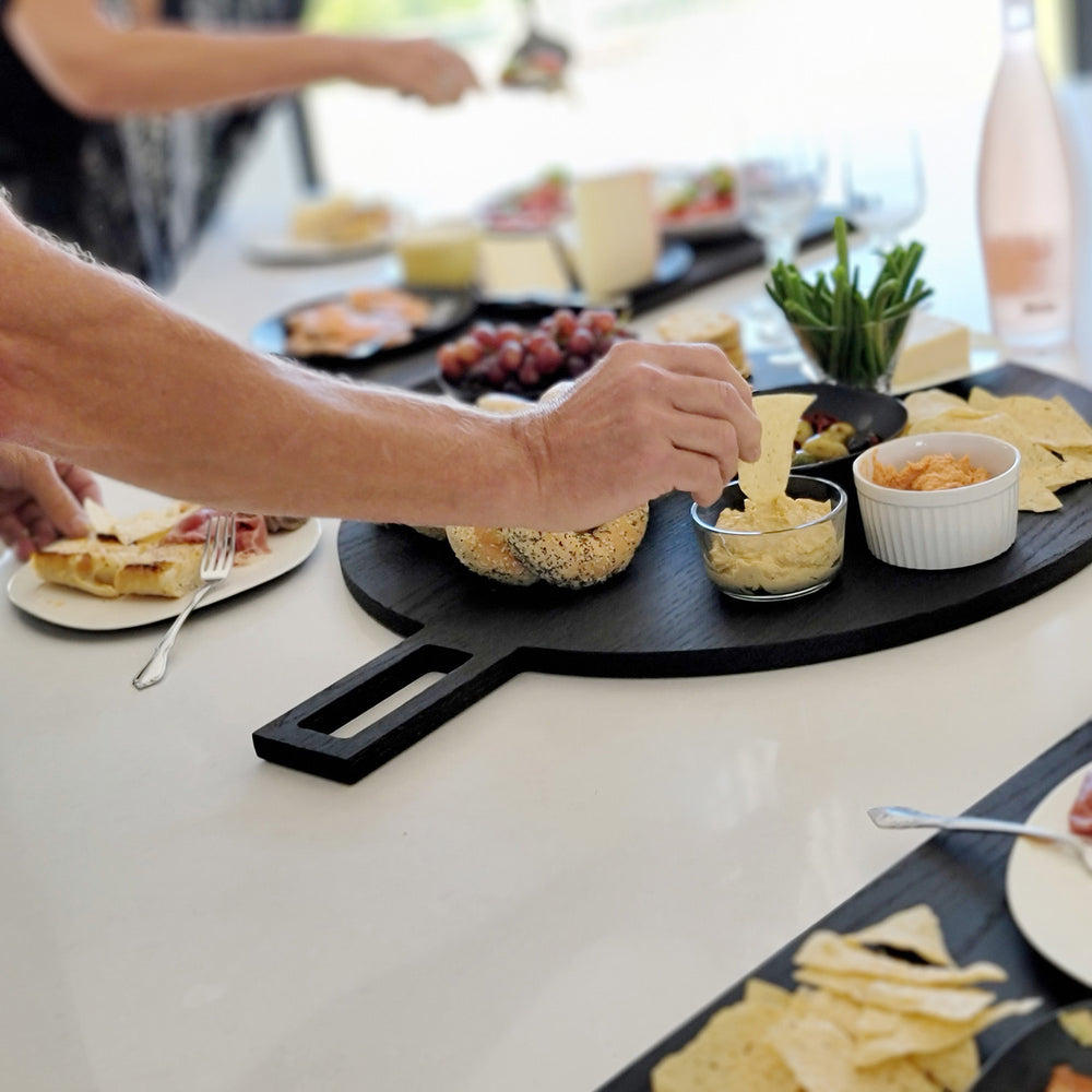 Oversized, blackened oak, food grade charcuterie boards. Ideal for serving many people at once. Uniquely designed by Big Wide Outside. 