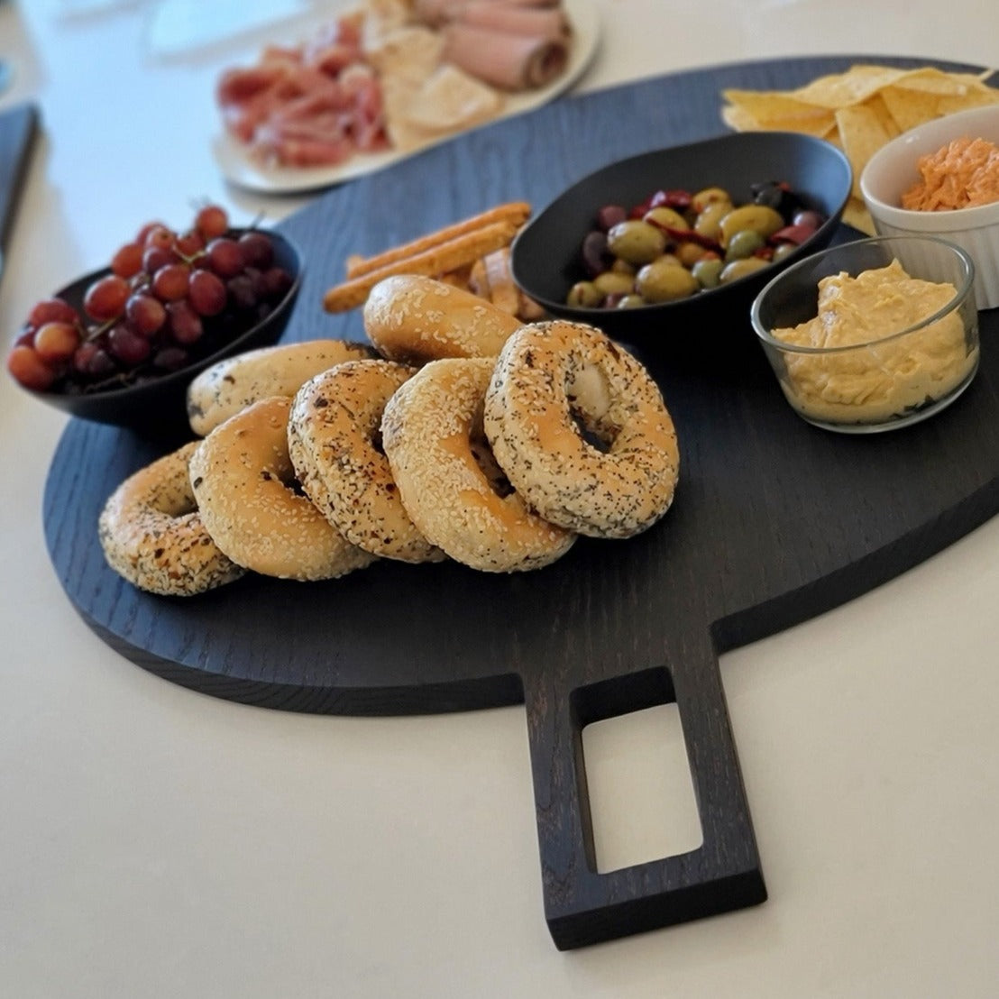 
                  
                    Oversized, blackened oak, food grade charcuterie boards. Ideal for serving many people at once. Uniquely designed by Big Wide Outside. 
                  
                