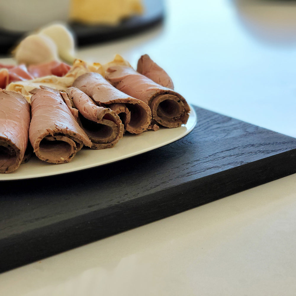 
                  
                    Oversized, blackened oak, food grade charcuterie boards. Ideal for serving many people at once. Uniquely designed by Big Wide Outside. 
                  
                