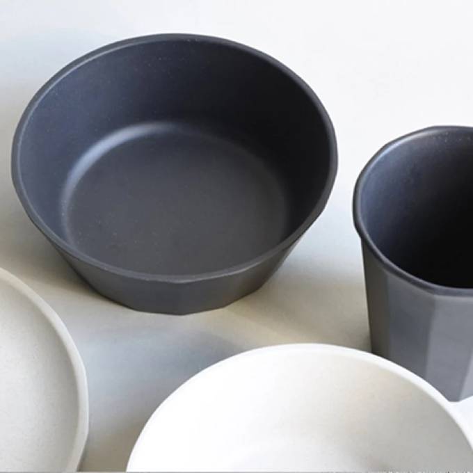 
                  
                    Selection of black and white bamboo bowls on a white background.
                  
                